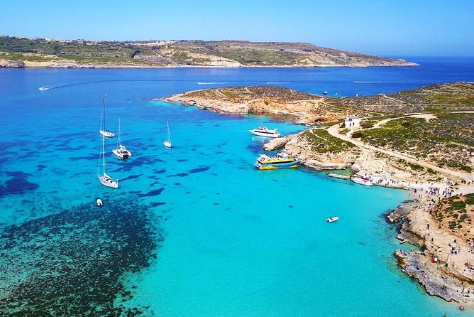 Blue Lagoon, Beaches and Bays Catamaran Sailing Tour - Ghajn Tuffieha Bay and the Popeye Village view