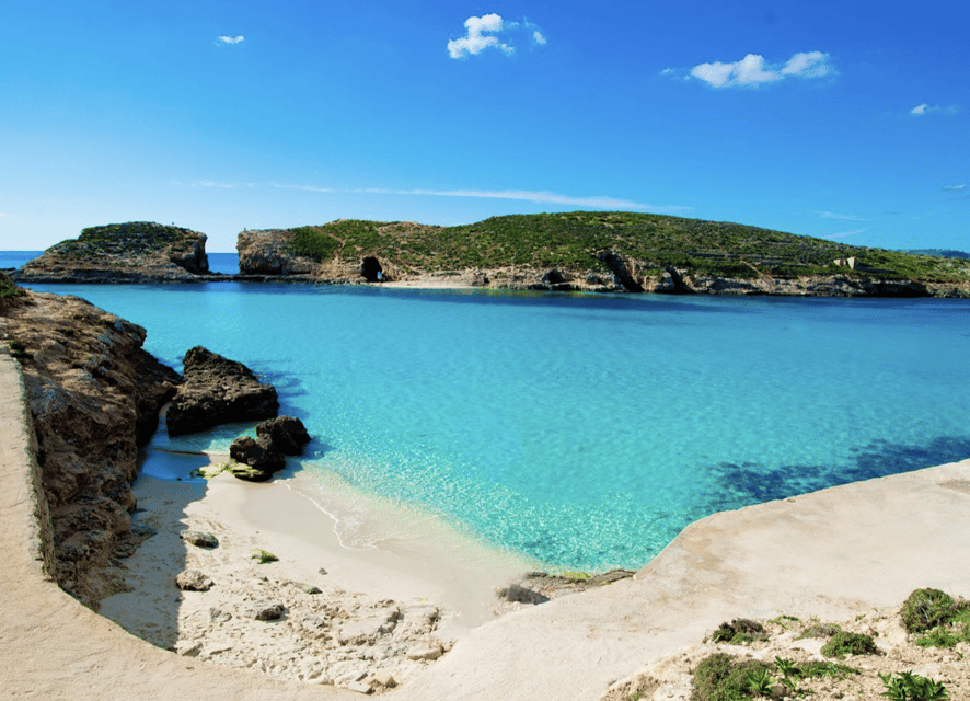Comino: Mystic Caves, Blue and Crystal Lagoon Boat Cruise - Cominotto Island from the water