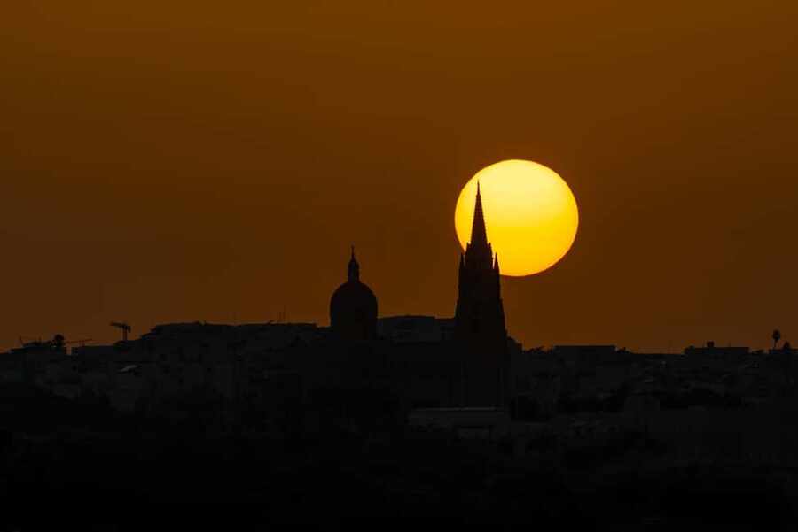 From Bugibba: Blue Lagoon Sunset Cruise - The nighttime return past Mellieha