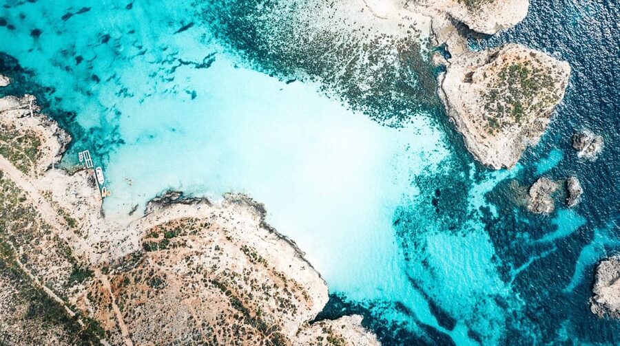 From Mellieha: Three Bay Cruise including the Blue Lagoon - Blue Lagoon: beautiful water, busy shore