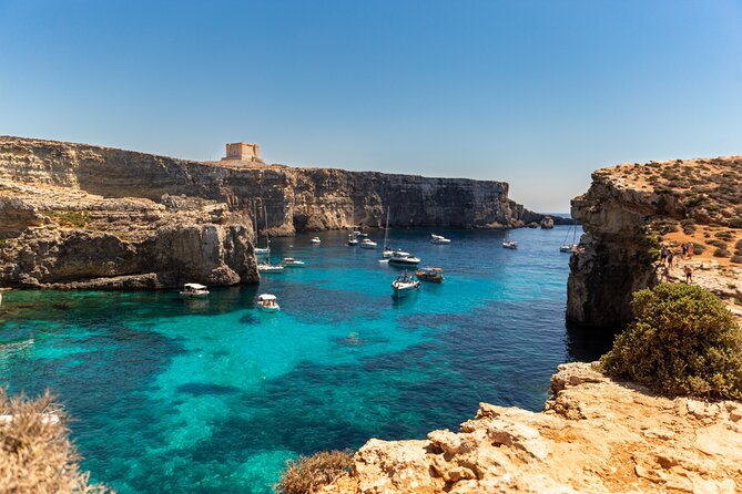 Gozo with bus including Blue Lagoon Comino & Sea Caves - Cruising Malta’s coast toward Comino