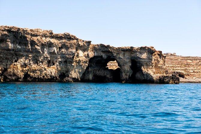 Half day Cruise - Comino, Gozo, Blue & Crystal Lagoon, and Caves - Blue Lagoon: beautiful water, busy shoreline