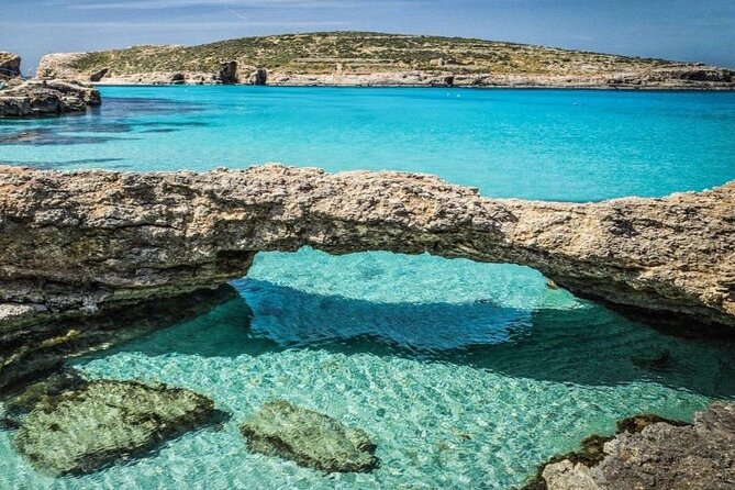 Half Day Malta Tour to Gozo Comino and Blue Lagoon Caves - Blue Lagoon: famous, beautiful, and busy