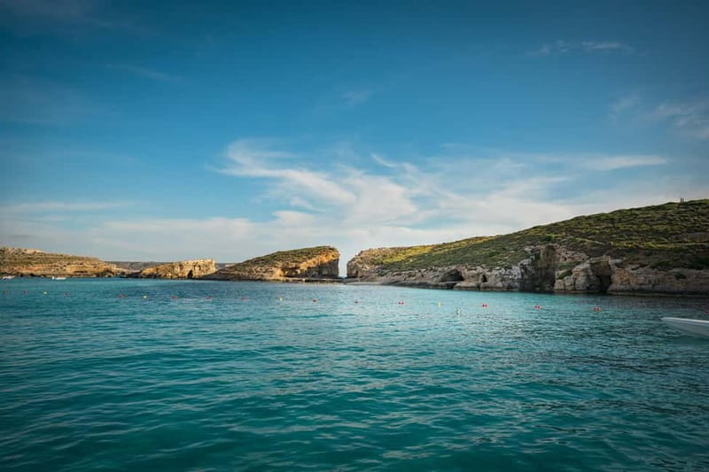 Malta: Comino, Gozo, Blue & Crystal Lagoon, and Caves Cruise - Cruising past Elephant Rock and Santa Maria Bay