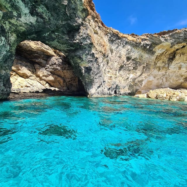 Malta:Gozo,Comino,Crystal/BlueLagoon&Caves Private Boat trip - Comino’s caves from the water