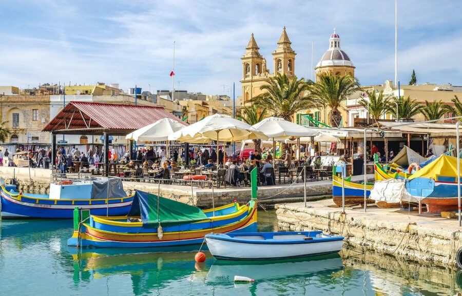 Malta: Marsaxlokk, Blue Grotto, and Qrendi Guided Tour - Seeing the Blue Grotto from the cliffs