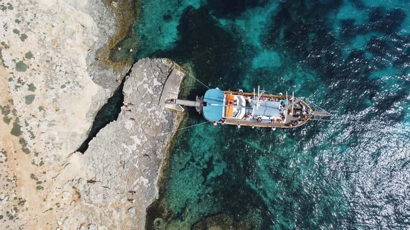 Malta: Sunset Cruise to Blue Lagoon and Caves - The first hour: St. Paul’s Island and Crystal Lagoon