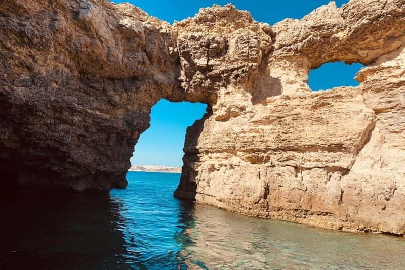 Mellieha: 1:00pm Speedboat round Comino Caves 2h Blue Lagoon - St. Marija Tower and island access rules