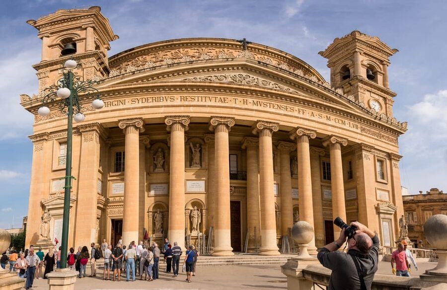 Mosta: City Highlights Tour with Buffet Lunch - Walking through a World War II shelter