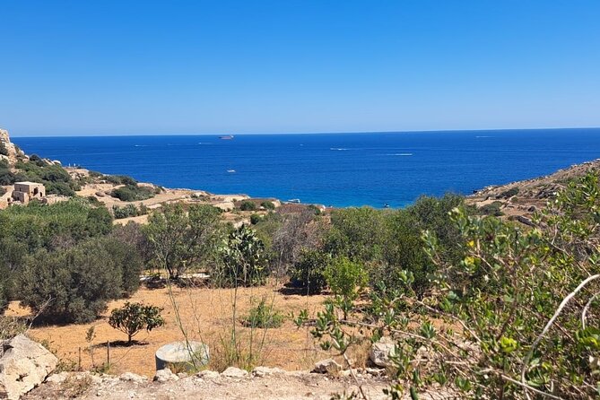 North Malta Quad Bike Tour with Land or Sea Views and Swimming - Mellieha Bay, sandy shore, and blue water