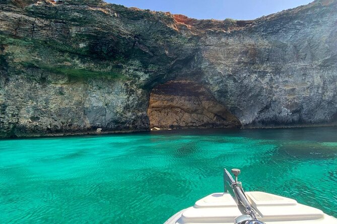 Private Boat Tour to Blue Lagoon Comino Caves and Gozo - A historic watchtower above the sea
