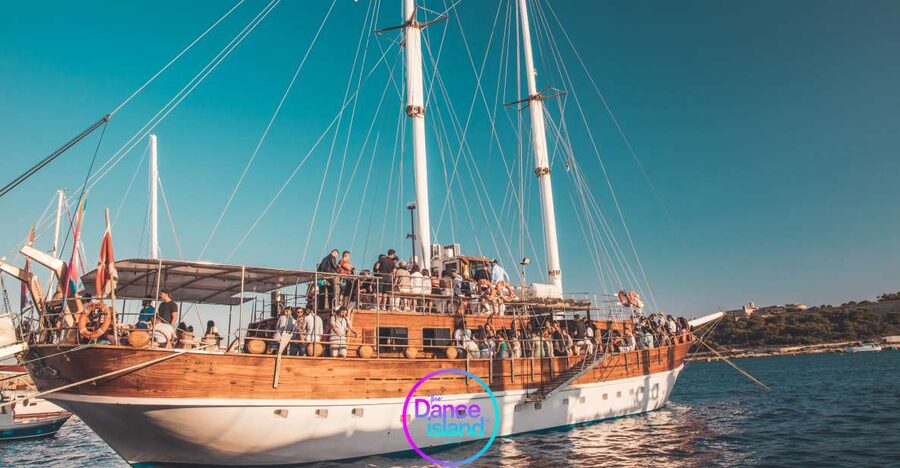 Sliema: Sailboat Party with an Open Bar, Food, and Swimming - Sunset views toward Valletta