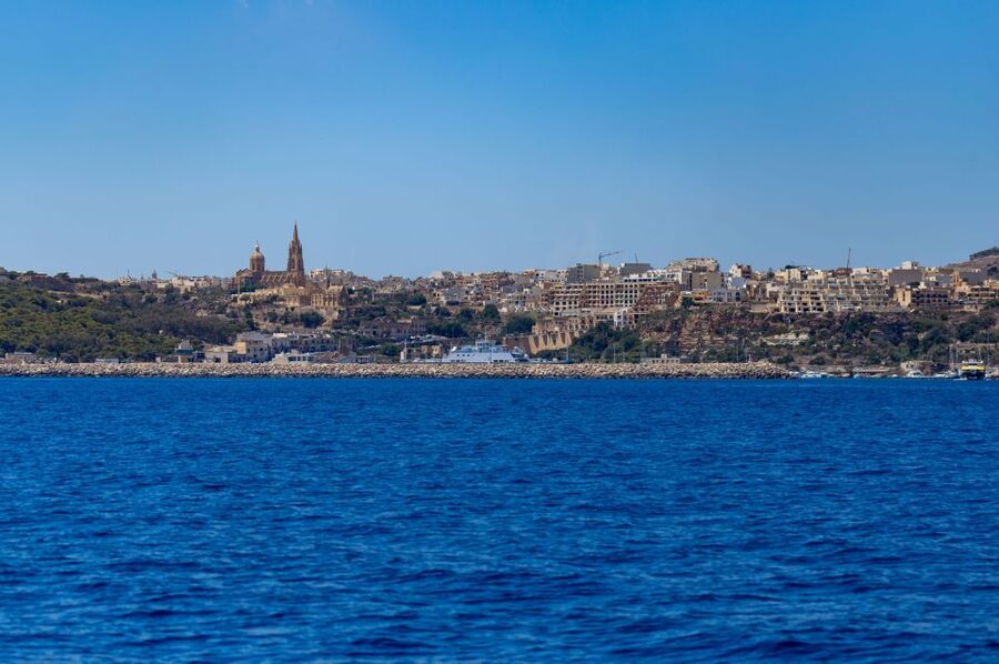 St. Paul's Bay: Gozo, Comino & St. Paul's Bus & Boat Tour - Coastal Caves and the Return Toward St. Paul’s Island