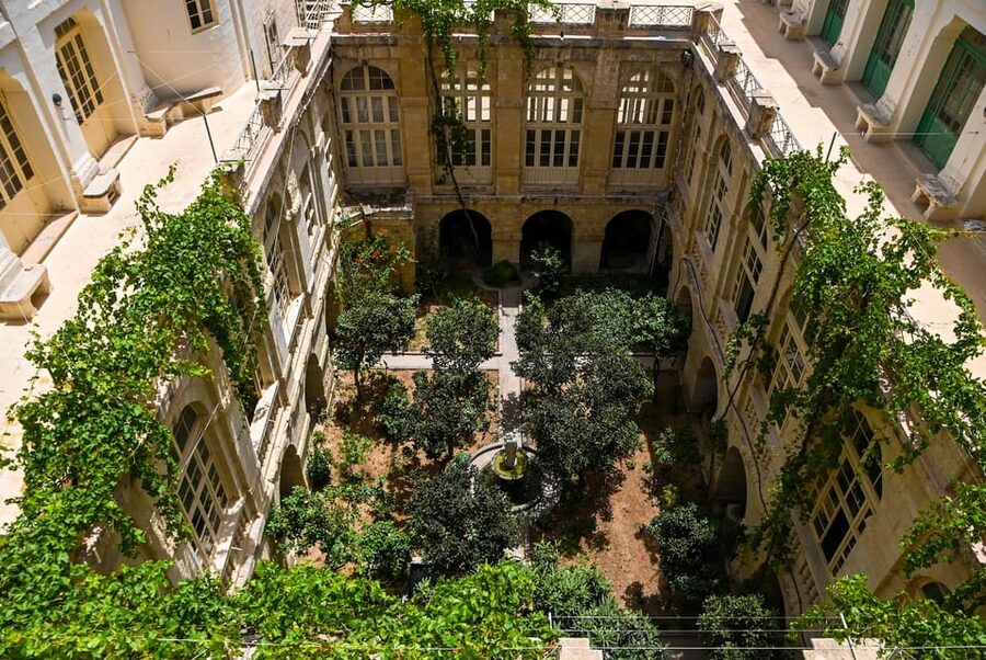 Valletta: Monastery and Secret Garden Entry Ticket - The cloisters, fountain, vines, and secret garden